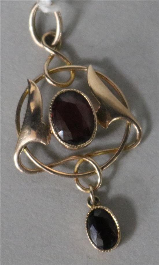 An Art Nouveau Murrle Bennett & Co 9ct gold and garnet set pendant, overall 39mm.